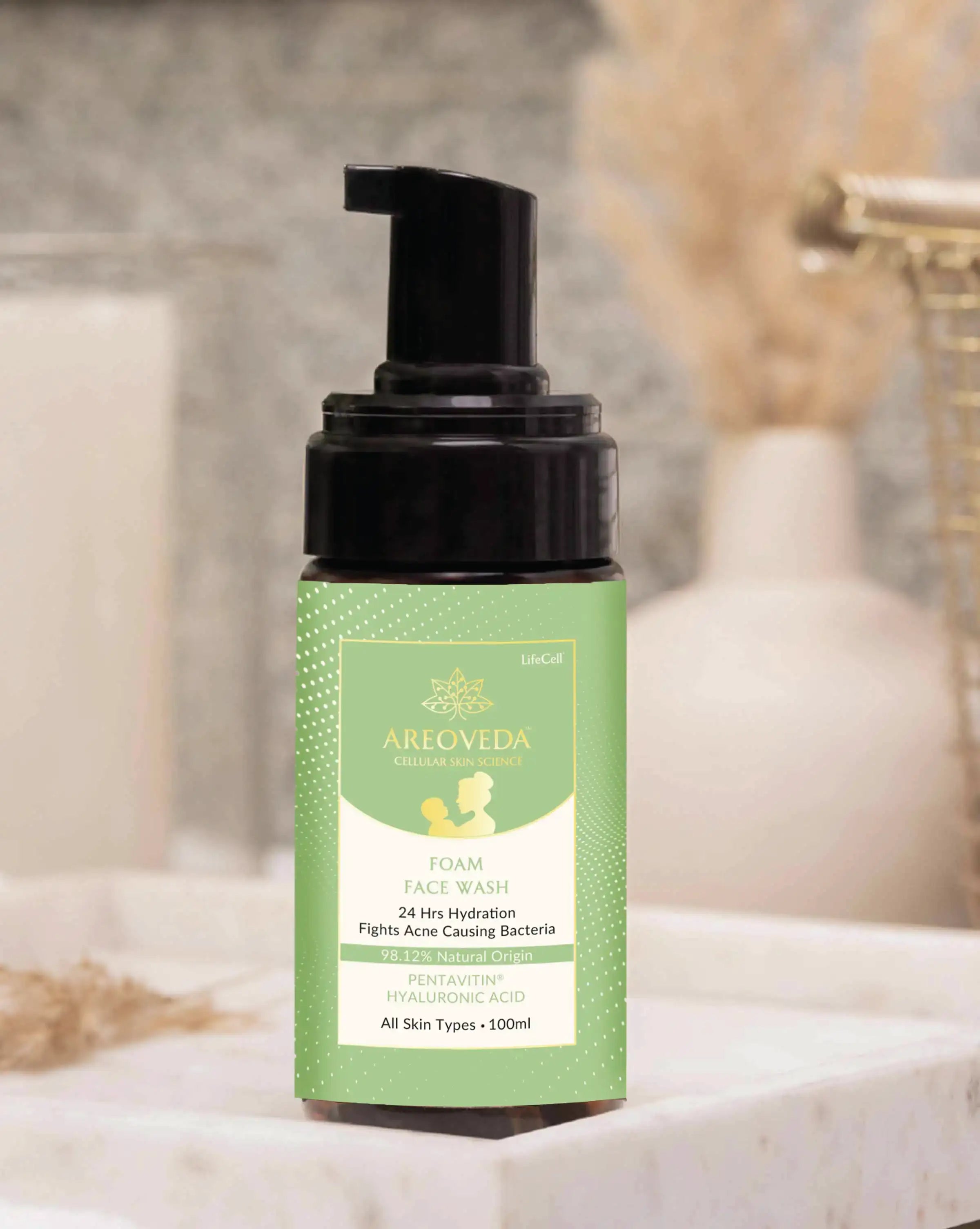 Foam face wash bottle with pump on a neutral background